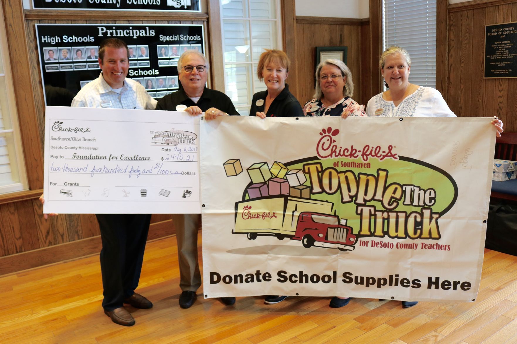 Topple The Truck raises money, school supplies